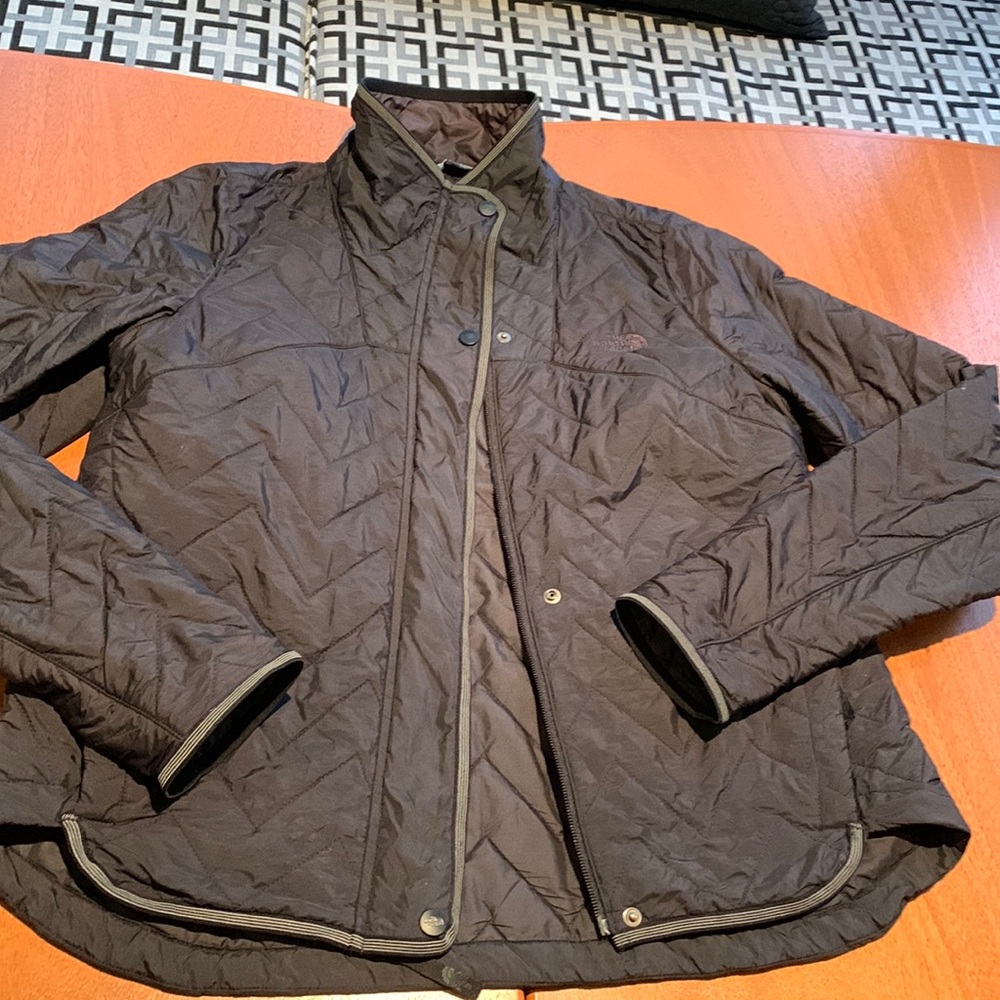The North Face Black quilted jacket. Medium